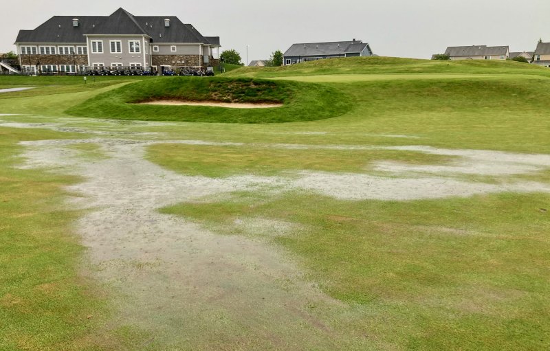 This is the sixth fairway at St. Anne’s Links, just in front of the green and a green side bunker. A large, heavy rainstorm the night of May 27 and into the next morning caused the cancellation of the second round of play for the DIAA State Golf Championship. This photo was taken 15 minutes before the second round was scheduled to begin.
